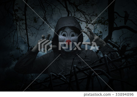 Scary evil clown wear jacket with old fence Scary evil clown wear jacket with old fence 33894896