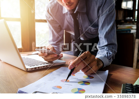 Businessman working with smart phone Businessman working with smart phone 33898378