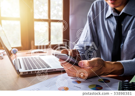 Businessman working and using smart phone Businessman working and using smart phone 33898381