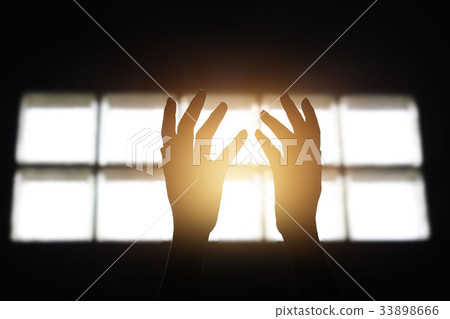 hands praying for blessing from god in room 33898666