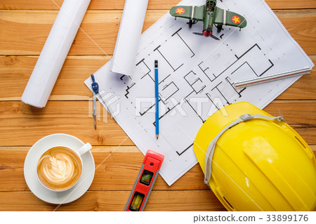 Architect desk project in construction site Architect desk project in construction site 33899176