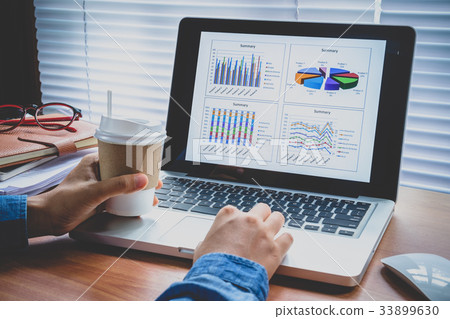 Businesswoman working with financial data Businesswoman working with financial data 33899630