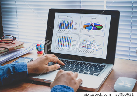 Businesswoman working with financial data Businesswoman working with financial data 33899631