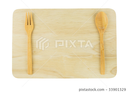 wooden spoon and fork on wooden board against  wooden spoon and fork on wooden board against  33901329