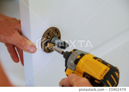 Installation of door lock using a screwdriver Installation of door lock using a screwdriver 33902479