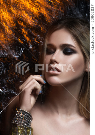 Beautiful girl with beautiful makeup, youth and 33902837