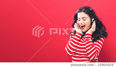 Happy young woman with headphones  33903029