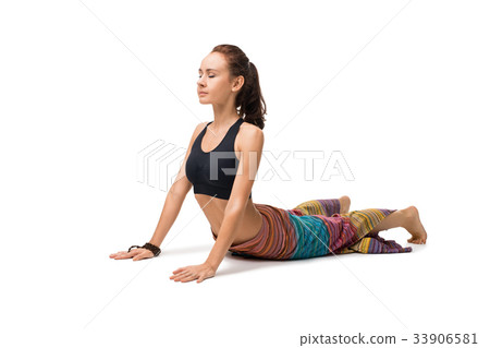 Slim girl doing yoga indoors isolated on white 33906581