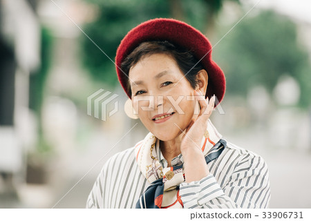 Senior lady in red beret Senior lady in red beret 33906731