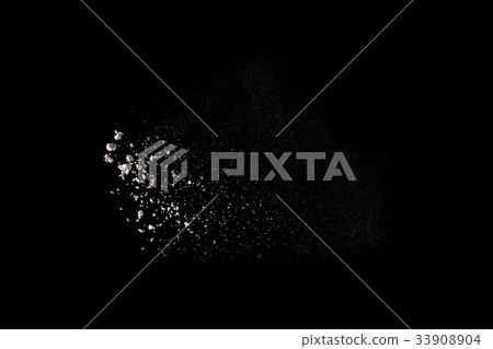 Launched white powder isolated on black background 33908904