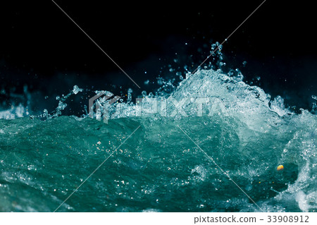 Splash of stormy water in the ocean on a black Splash of stormy water in the ocean on a black 33908912