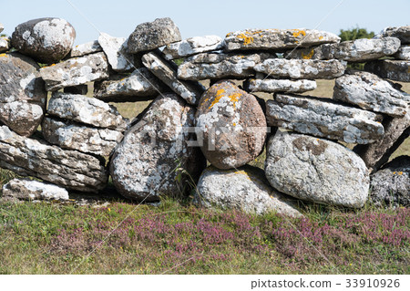 Traditional dry stone wall closeup 33910926