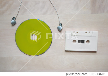 song disc with white earphone and cassette tape 33913605