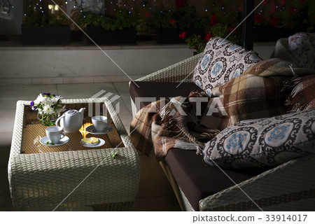 plaid on the sofa and hot tea in table plaid on the sofa and hot tea in table 33914017