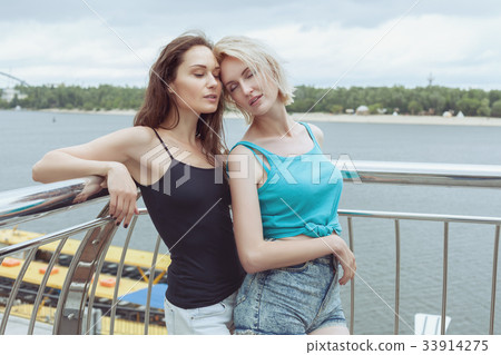 Woman touched the woman and was thrilled. Woman touched the woman and was thrilled. 33914275