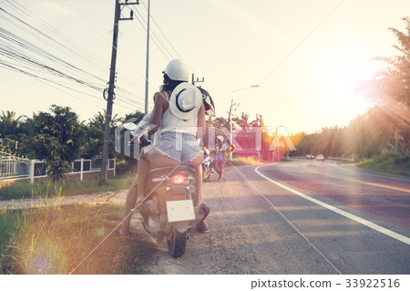 Back Rear View Of Couple Riding On Motorcycle 33922516