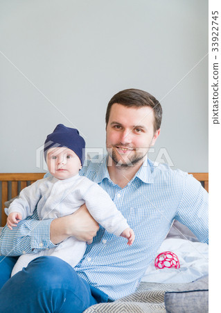 Close-up portrait of happy young father hugging Close-up portrait of happy young father hugging 33922745