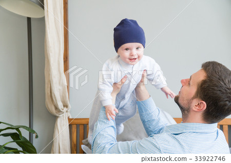 Close-up portrait of happy young father hugging 33922746