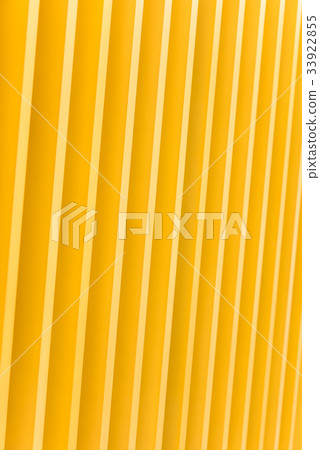 Detail of yellow metal building facade 33922855
