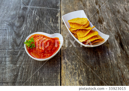 corn chipswith spicy adjika salsa 33923015