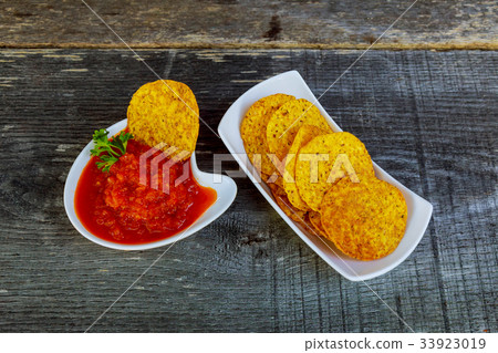 Nachos corn chips with adjika spicy sauce table Nachos corn chips with adjika spicy sauce table 33923019