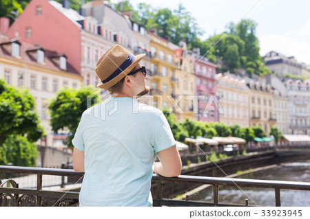 Back view of happy stylish tourist on Czech Back view of happy stylish tourist on Czech 33923945
