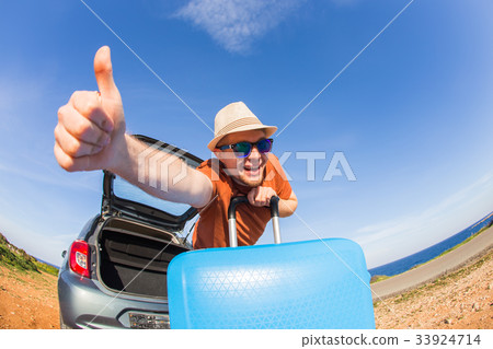 Looking at camera, a cheerful man going away for Looking at camera, a cheerful man going away for 33924714
