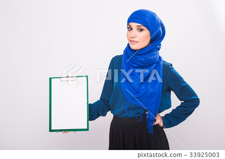 Arabic Muslim beautiful woman holding banner for Arabic Muslim beautiful woman holding banner for 33925003
