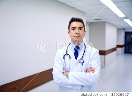 doctor with stethoscope at hospital corridor 33926967