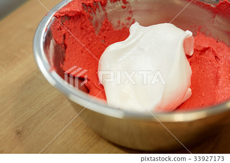 macaron batter with whipped egg whites in bowl macaron batter with whipped egg whites in bowl 33927173