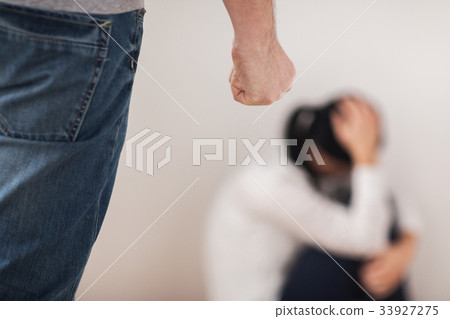 unhappy woman suffering from domestic violence 33927275