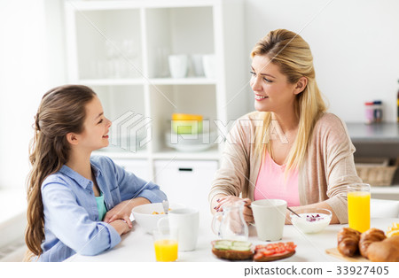 happy family having breakfast at home kitchen 33927405