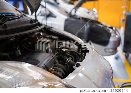 car in garage. vehicle maintenance in auto repair service. automobile annual checkup. fixing, checking concept 33929344