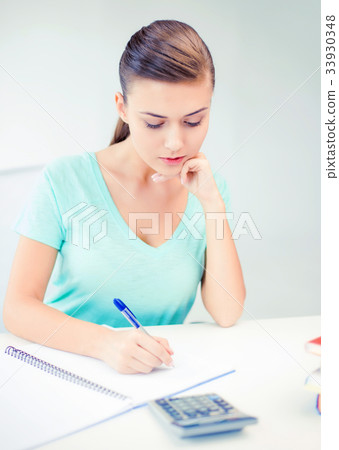student girl with notebook and calculator 33930348