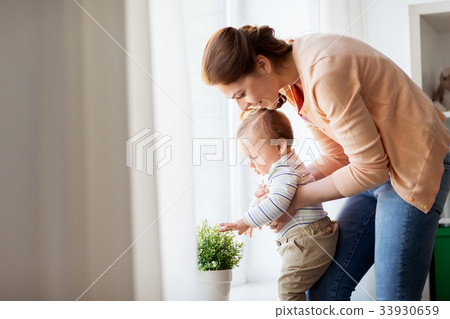 happy young mother with little baby at home happy young mother with little baby at home 33930659