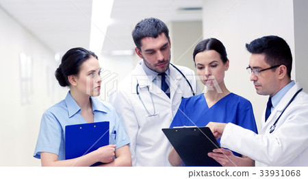 group of medics at hospital with clipboard 33931068