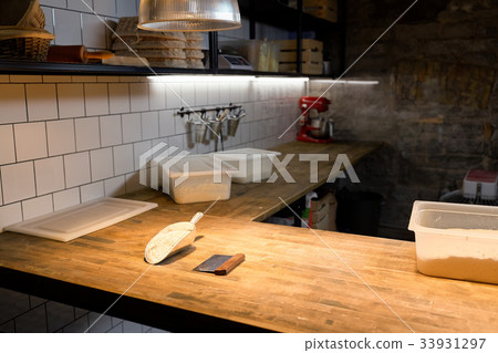dough and baking tools on bakery kitchen table dough and baking tools on bakery kitchen table 33931297