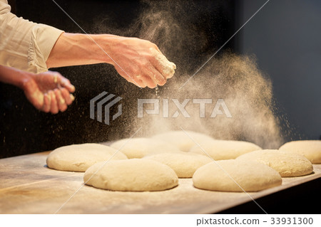 chef or baker cooking dough at bakery chef or baker cooking dough at bakery 33931300