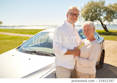 happy senior couple at car in summer 33932397
