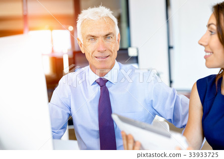 Businessman at the office Businessman at the office 33933725