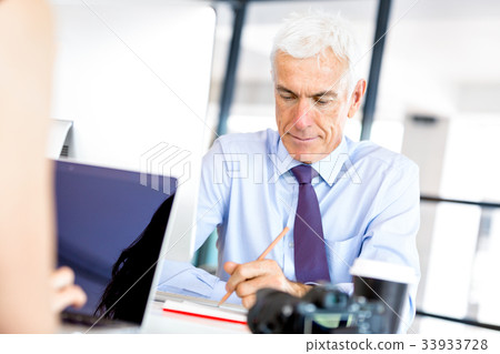 Businessman at the office Businessman at the office 33933728