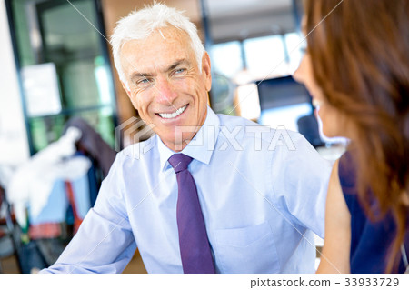 Businessman at the office Businessman at the office 33933729