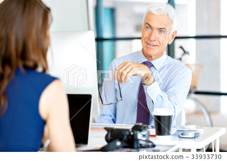 Businessman at the office Businessman at the office 33933730