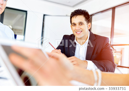 Businessman at the office Businessman at the office 33933731