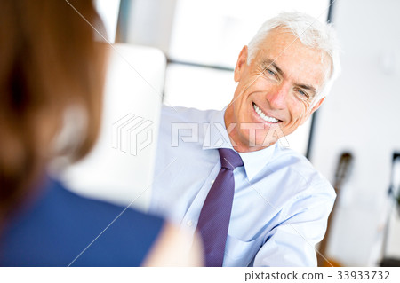 Businessman at the office Businessman at the office 33933732