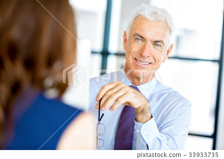 Businessman at the office Businessman at the office 33933735