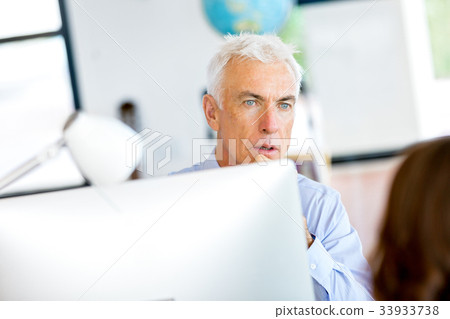 Businessman at the office Businessman at the office 33933738