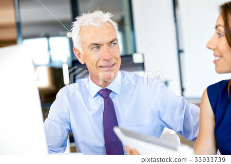 Businessman at the office Businessman at the office 33933739