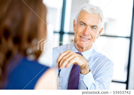 Businessman at the office Businessman at the office 33933742