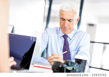 Businessman at the office Businessman at the office 33933743